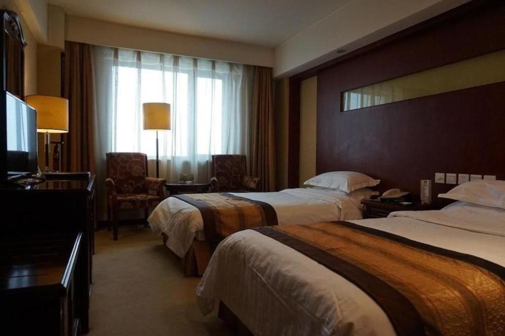 Heilongjiang Kunlun Hotel Harbin Exterior photo